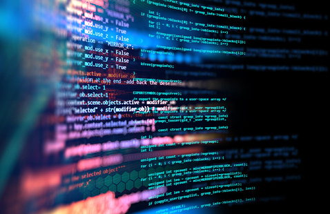 code in pink, blue, green on a dark background