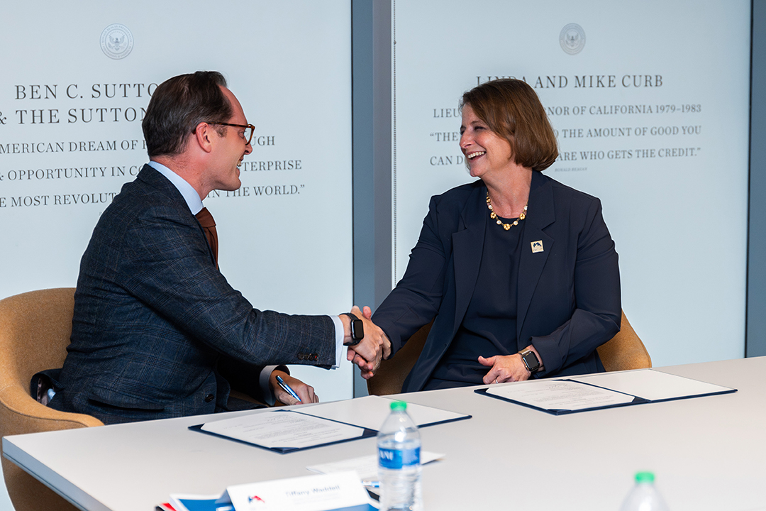 Handshake with CPS dean and RRI director