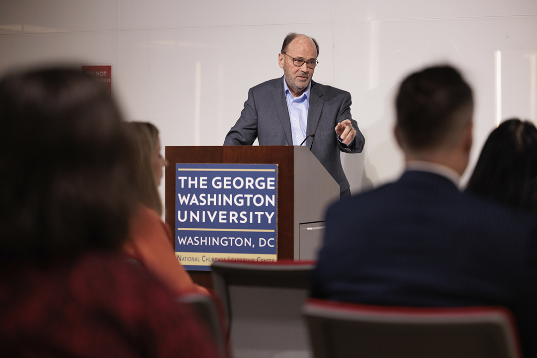 Larry Parnell at podium with audience