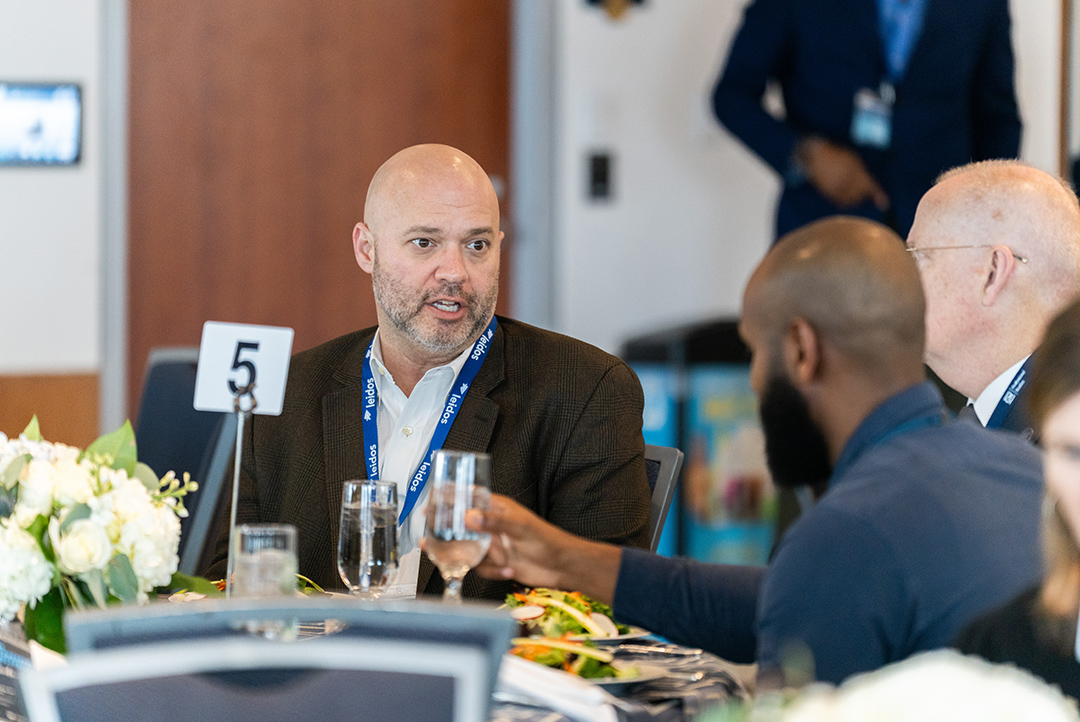 VIP luncheon participants talking amongst themselves at 2025 Cybersecurity Conference