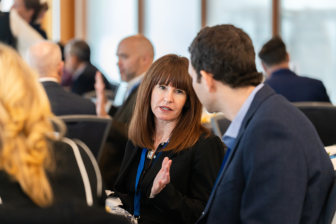 VIP luncheon participants talking amongst themselves at 2025 Cybersecurity Conference