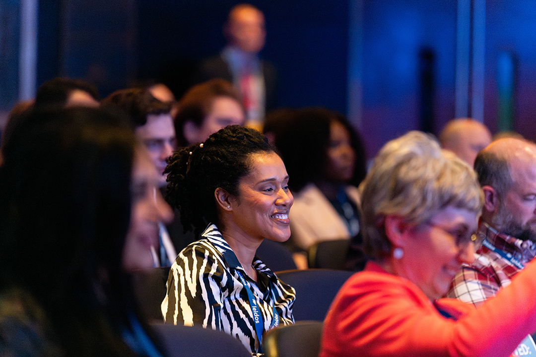 audience engaging with speakers, talking, raising hands