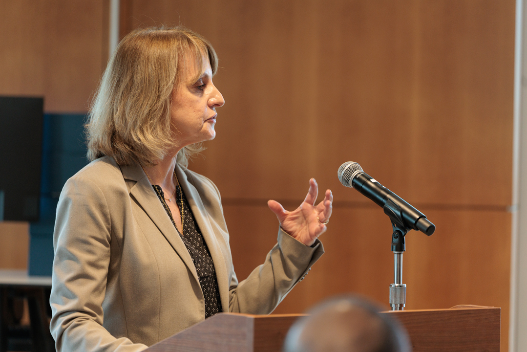 Elaine Lammert speaking at podium
