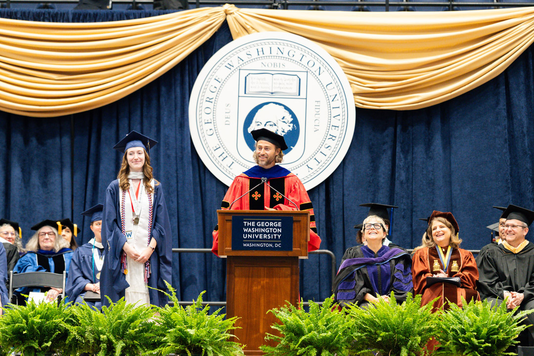 Sarah Alison Freeman and Casey Burgat stand onstage