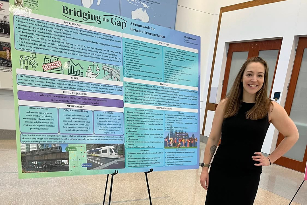Female student with her capstone research poster