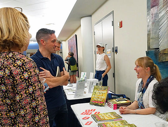Claudia West signs copies of her book - Planting in a Post-Wild World at the April 13 event