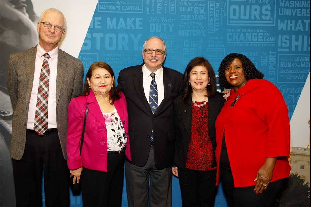 4 CPS employees with 20 or more years of service with the GW president