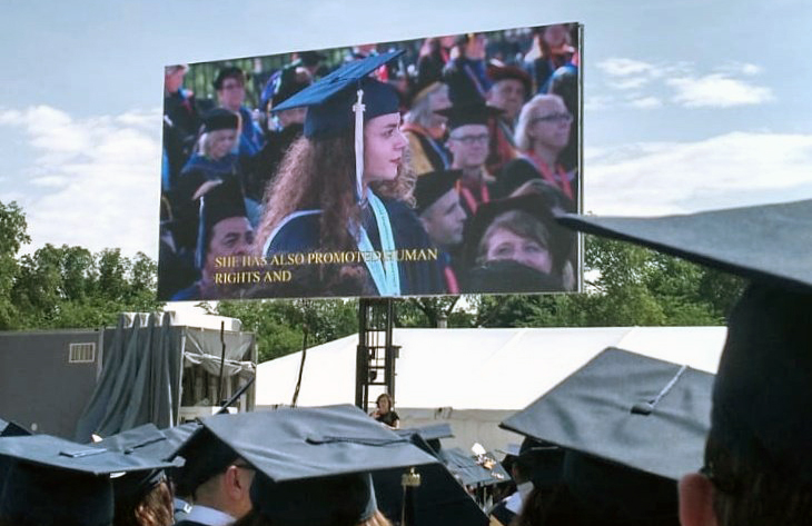 graduation ceremony with cap and gowns