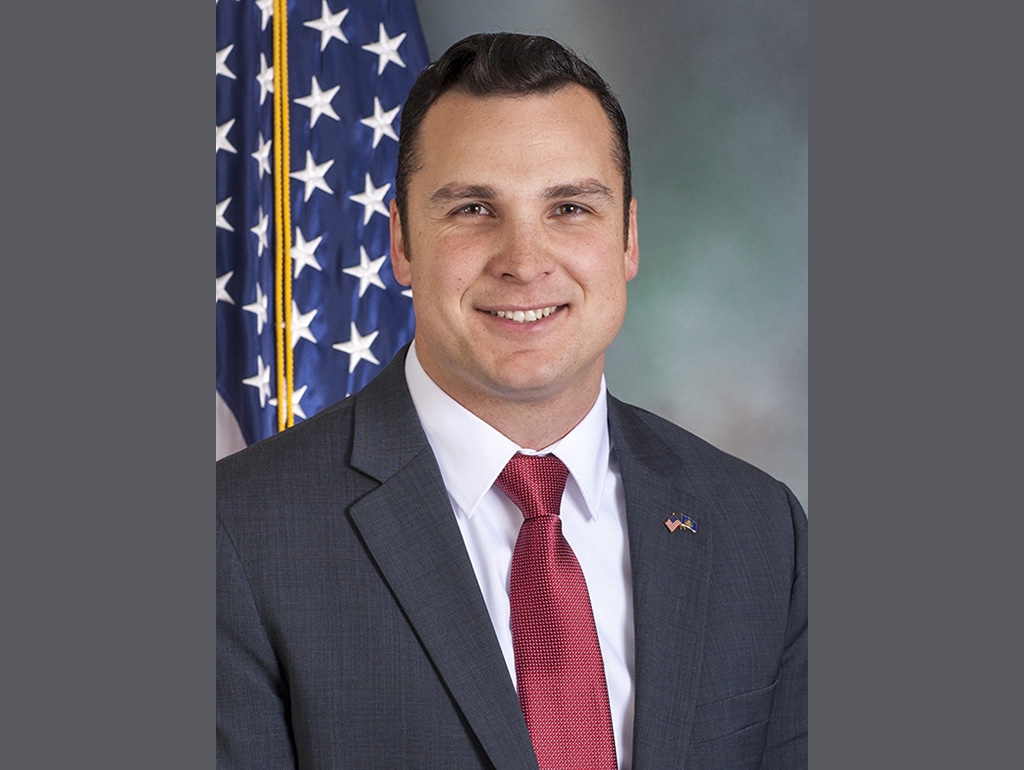 Andrew Lewis with US flag