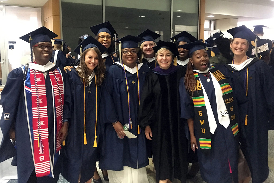 Paralegal student group in cap and gown attire