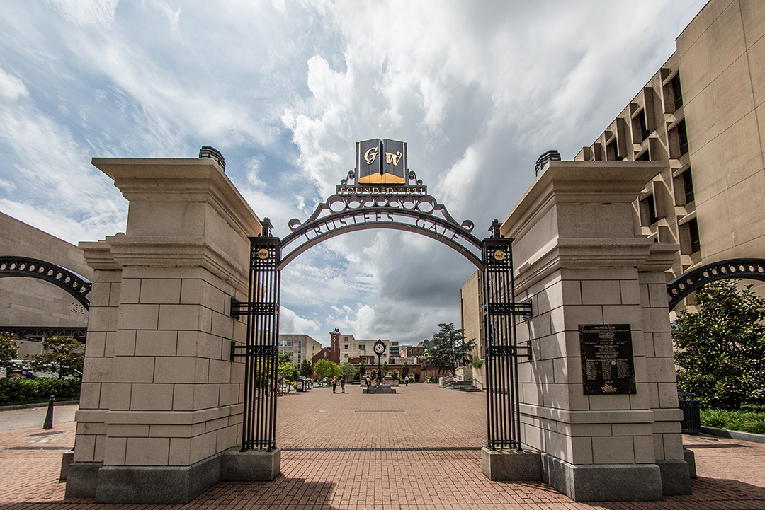 Trustees gate at GW with words GW above the arch