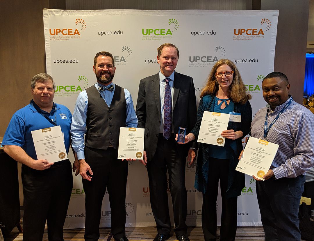 4 CPS Marketing team members and UPCEA president pose with award certificates.