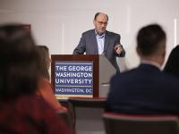 Larry Parnell at podium with audience