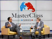 Rep. Will Hurd and Steven Billet sitting onstage in front of MasterClass series screen