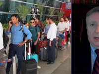Scott White media interview and large line of people at airport with suitcases