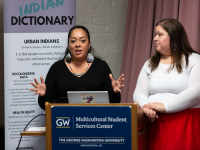 two women presenting report from the Urban Indian Health Institute at GW
