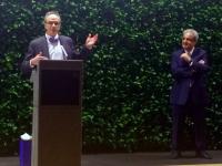 GSEHD Dean Michael Feuer speaks at the reception April 3 in honor of former dean Ali Eskandarian (right).