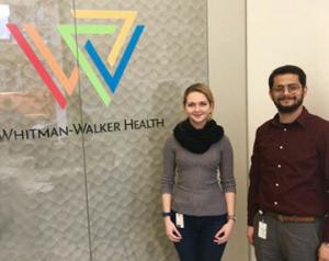 Two people standing in front of whitman walker health