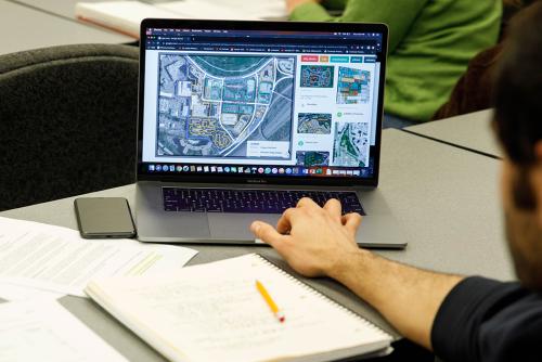 Student looks at land use study on computer screen