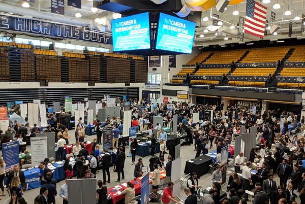 LinkedIn Groups with graphic of hands (with large black watch on left wrist) typing on a laptop that is open