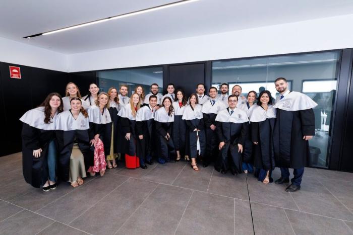 Group of University of Navarra students pose and smile together