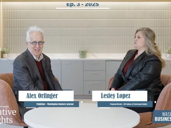 Alex Orfinger and Lesley Lopez sitting in chairs opposite one another
