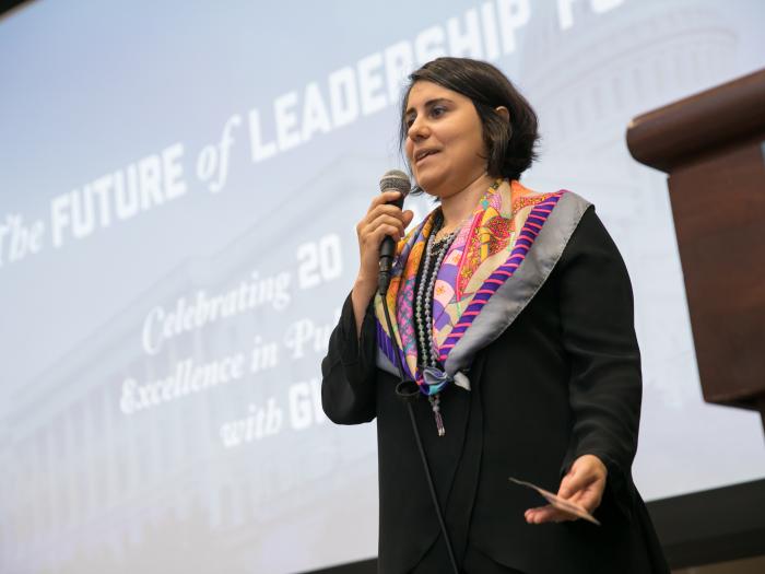 Ina Gjikondi with microphone