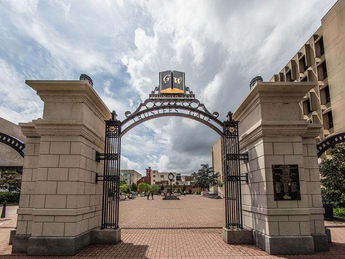 Trustees gate at GW with words GW above the arch