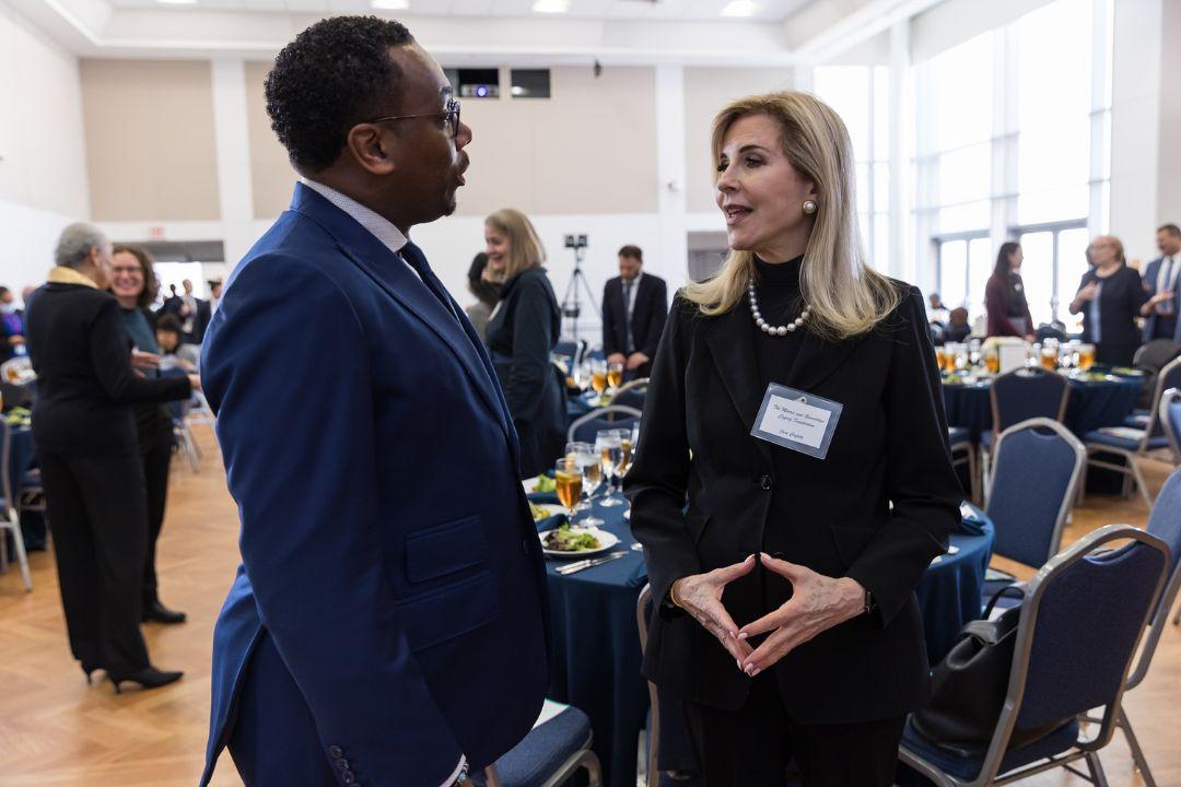 Charles Hall and Jane L. Cafritz engrossed in conversation