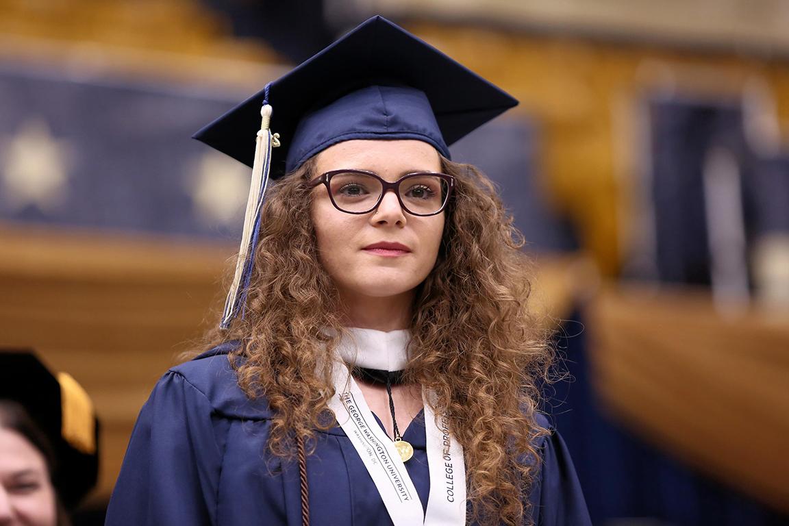 Fjolle graduating student in cap and gown